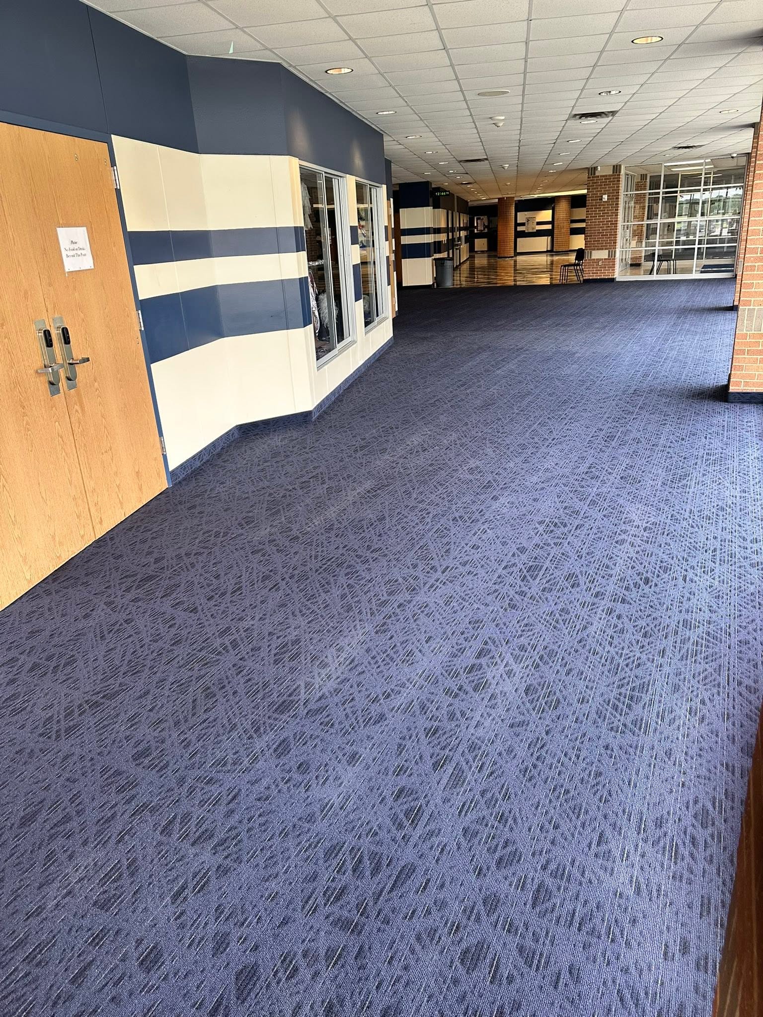 Bulldog Carpet Cleaning technician using hot-water extraction wand on residential carpet in Hunt County, TX