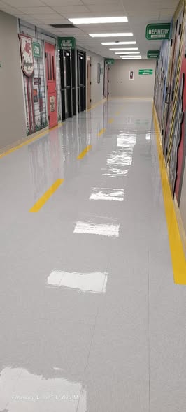 Polished hallway floor showing mirror-like reflective shine after professional cleaning in Greenville, TX