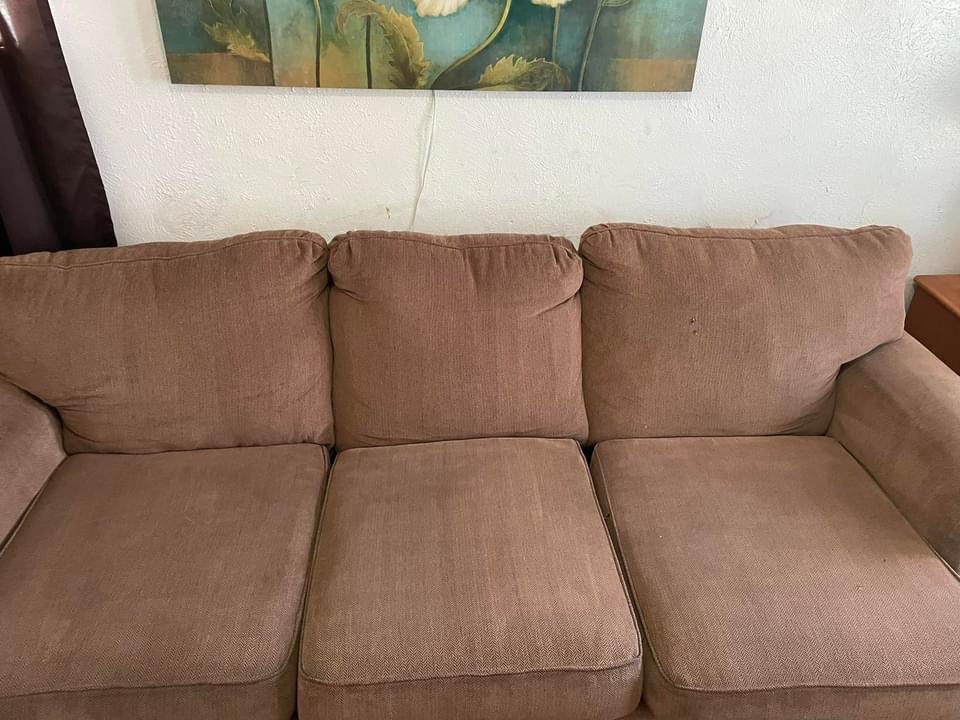 Clean tan fabric sofa after professional upholstery cleaning service in Greenville, TX by Bulldog Carpet Cleaning